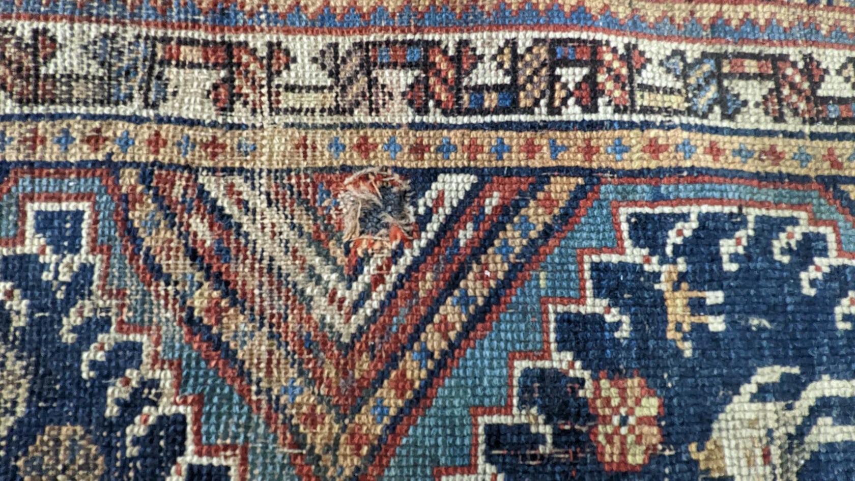 A pair of antique Caucasian blue ground rugs, 290 x 132cm